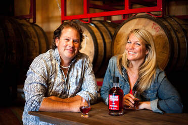 Owners Fred and Amy in distillery